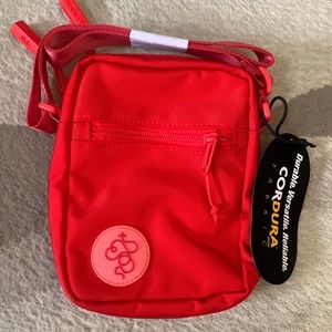 Baboon To The Moon red sling bag